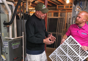 Arlinghaus technician educates customer on changing air filter