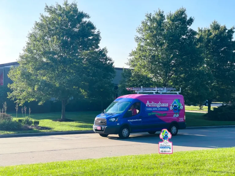 Arlinghaus service van parked in front of a home